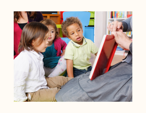 Librarian reading to toddlers.